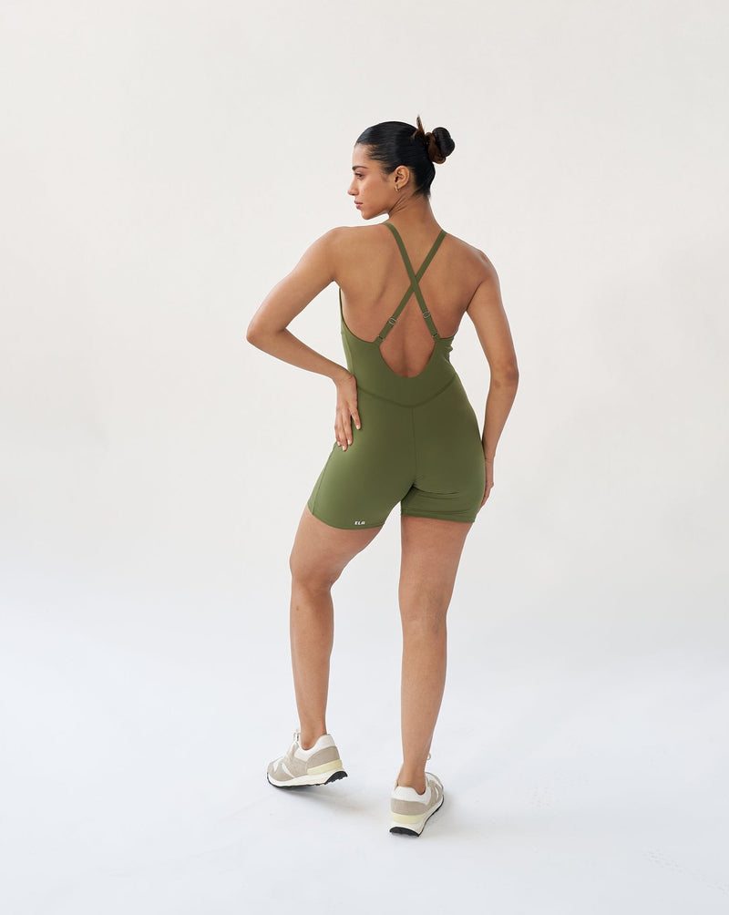 Back view of green Corset Bodysuit highlighting the deep scoop back and adjustable straps, perfect for yoga or strength training.