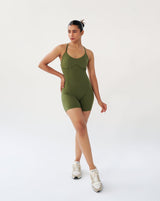 Front view of green Corset Bodysuit with adjustable criss cross shoulder straps and deep scoop back, designed for strength training or yoga.